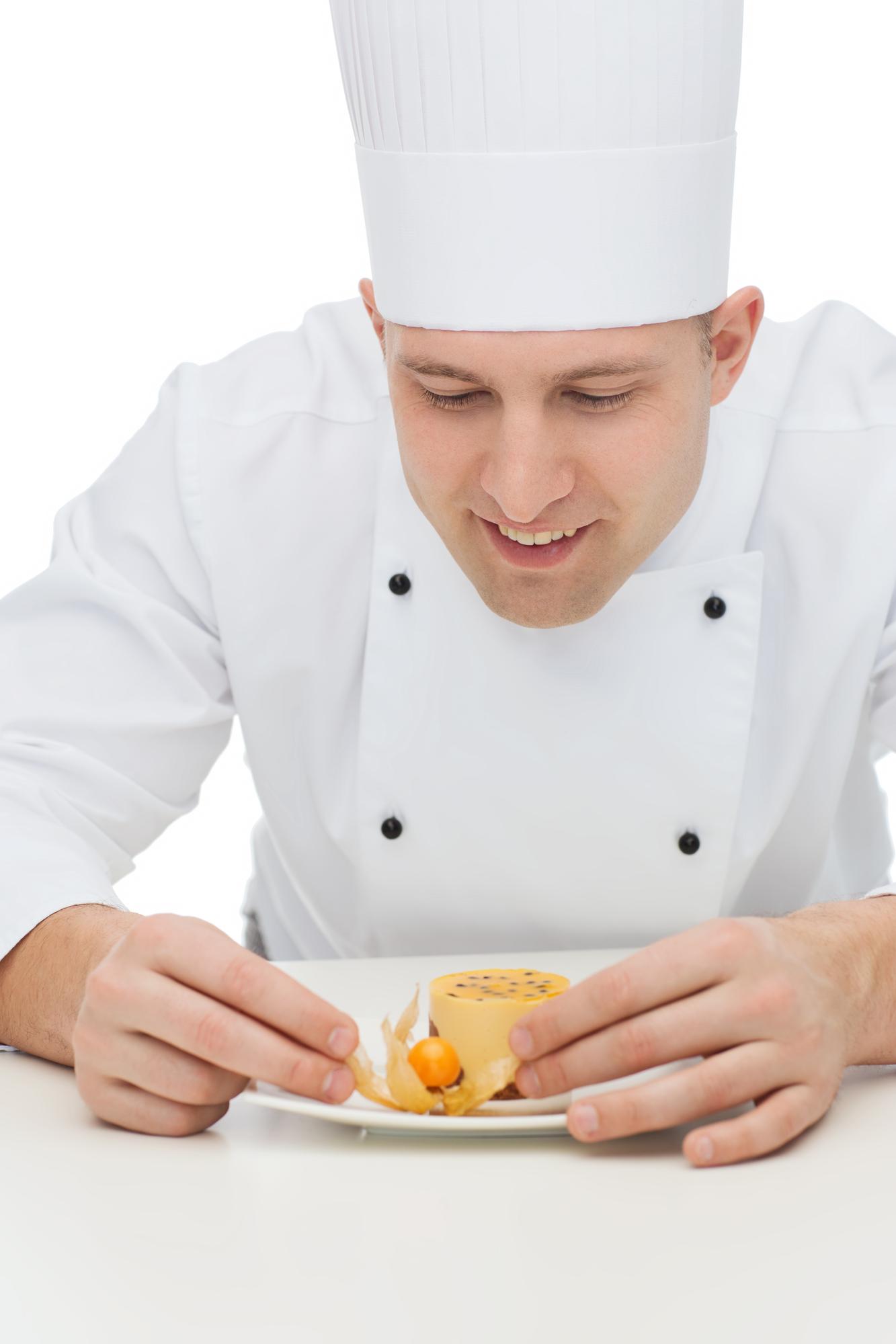 Chef showing plated dish to students